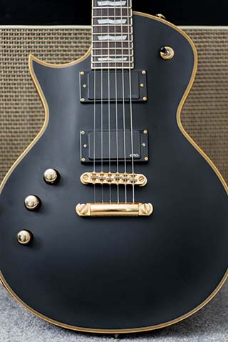 Left handed ESP LTD EC-1000 leaning against an amplifier