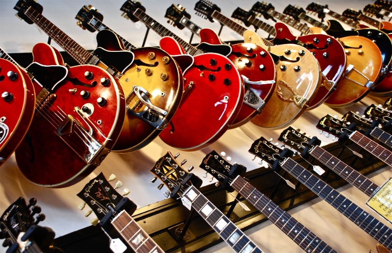 Wall of Guitars - Photo by Susan Mohr on Unsplash