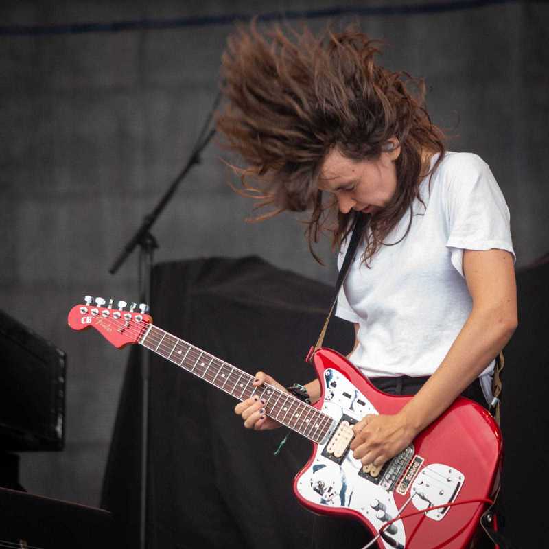 Courtney Barnett playing a red left handed Fender Jaguar, live at Newport Folk Festival, Newport.