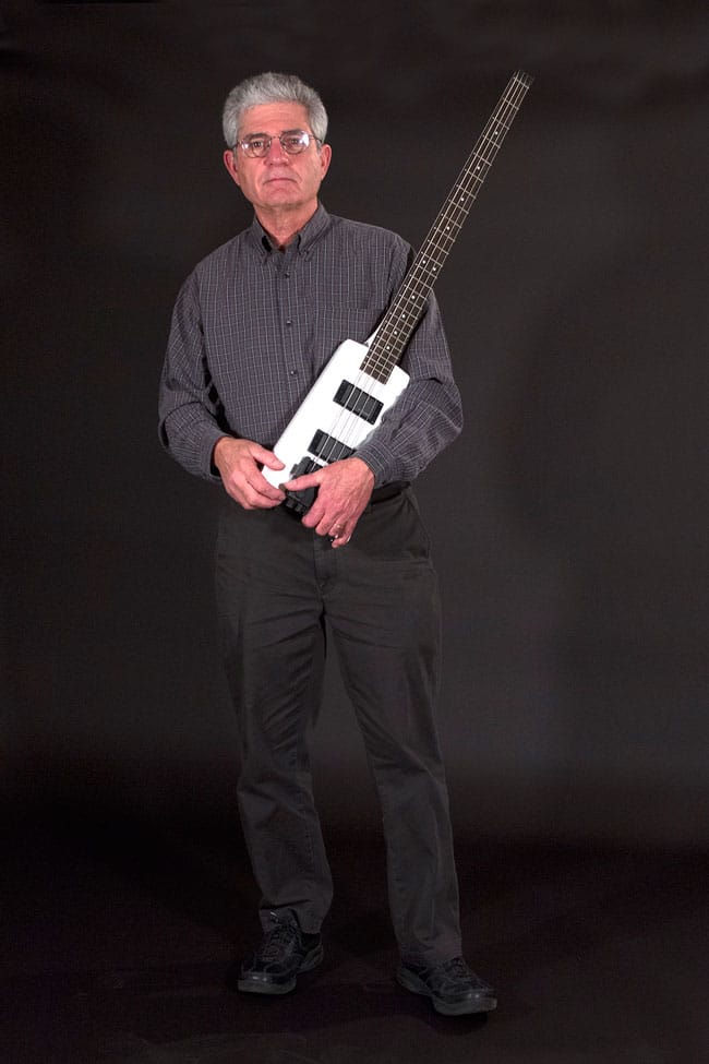 Ned Steinberger standing with a white Steinberger XT-2DB Bass