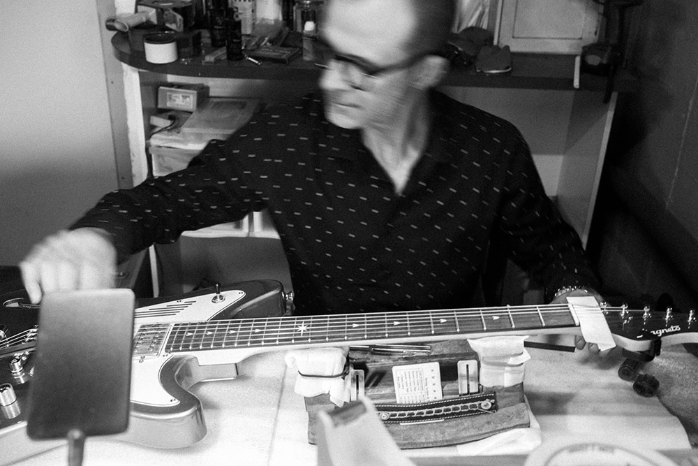 Magneto Guitars founder Christian Hatstatt setting up a Magneto Starlux guitar in his workshop