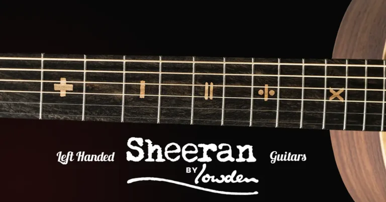 Left Handed Sheeran Guitars - The image shows a close-up of the fingerboard of a left-handed Tour Edition Sheeran Guitar, featuring unique fret markers in the shape of mathematics symbols including an addition sign, a subtraction sign, an equals symbol, a division symbol, and a multiplication sign. The "Sheeran by Lowden" logo is prominently displayed beneath the fingerboard, with the text "Left Handed" in an elegant font to the left of it, and "Guitars" to the right. The background is dark, making the intricate fretboard inlays and logo stand out clearly. The guitar's body is partially visible at the right edge of the image.